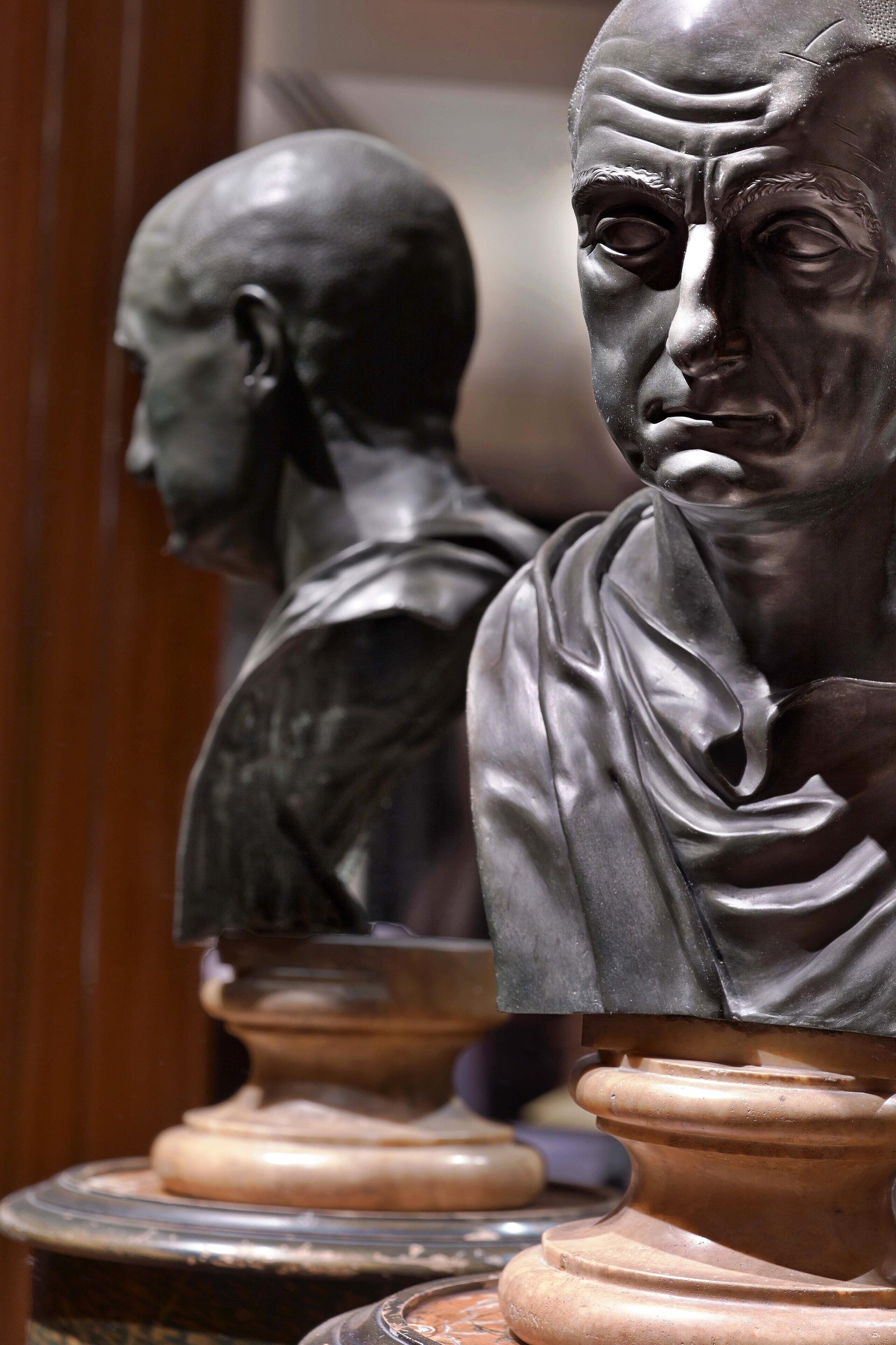 A bust sculpture on a pedestal.