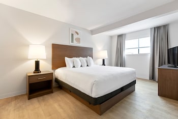 One Bedroom Suite with Full Kitchen | Desk, iron/ironing board, free WiFi, bed sheets at WaterWalk Atlanta Perimeter Center