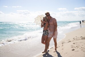 On the beach, beach cabanas, sun loungers, beach umbrellas