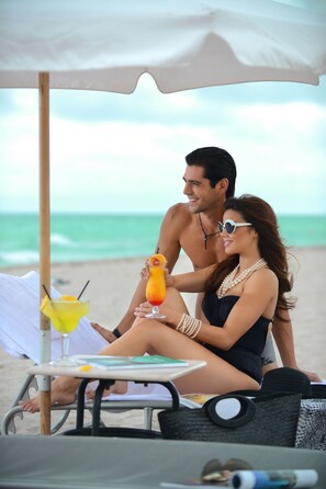 On the beach, sun loungers, beach umbrellas, beach towels