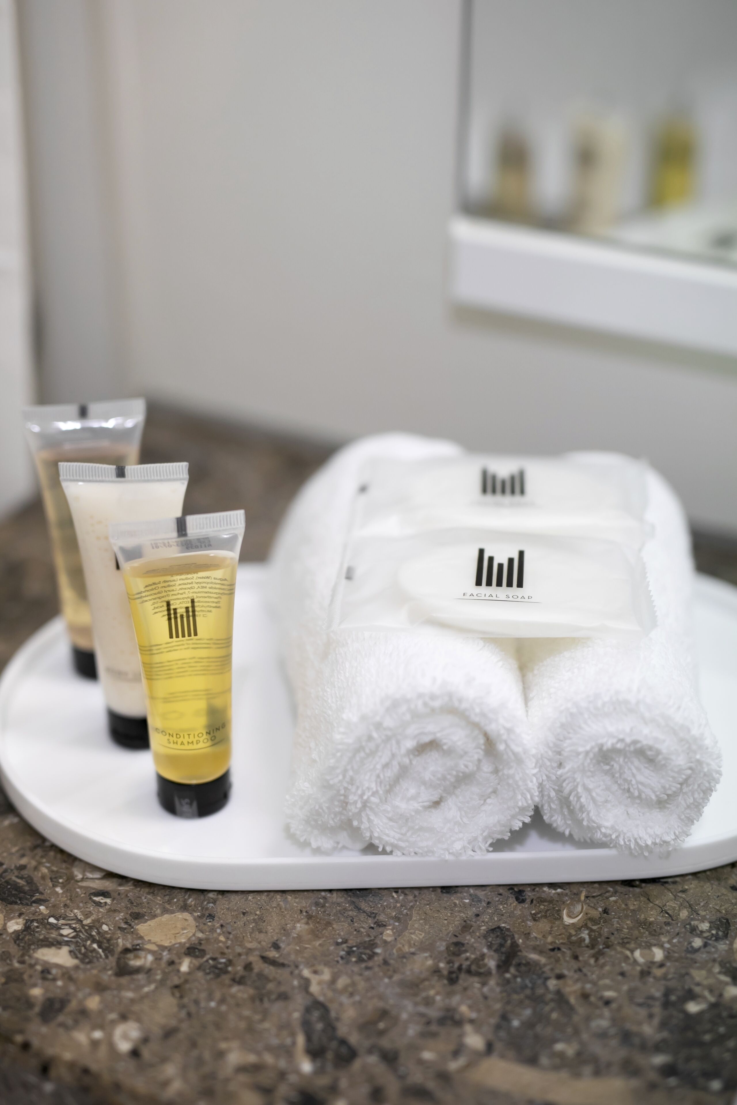 eco-friendly toiletries, hair dryer, towels