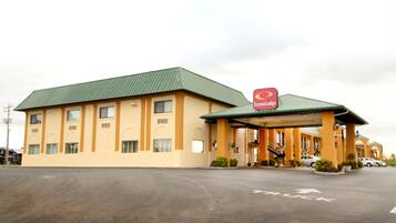 A two-story motel with a green roof and a sign for EconoLodge.