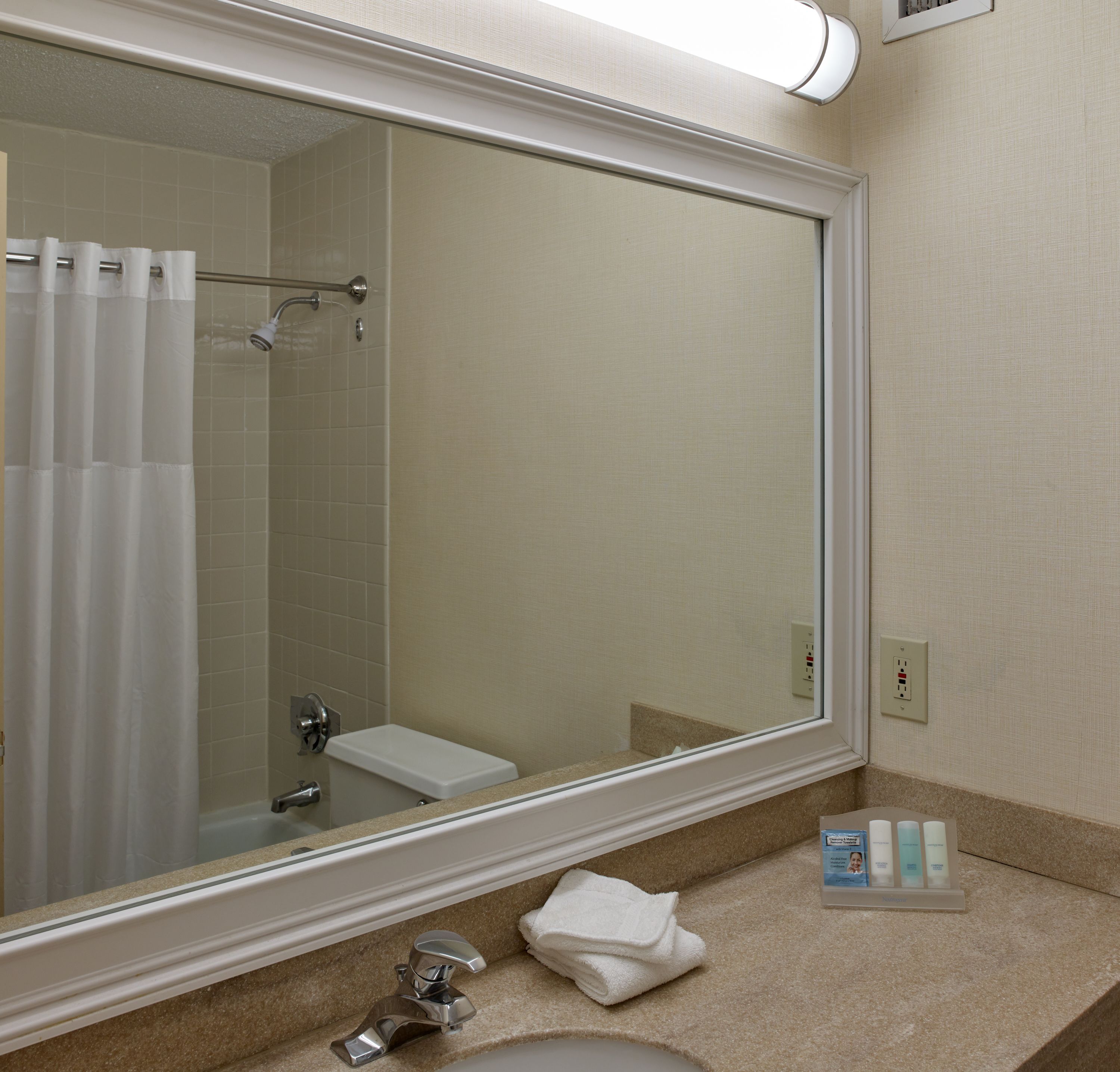 pillow-top beds, desk, laptop workspace, blackout curtains