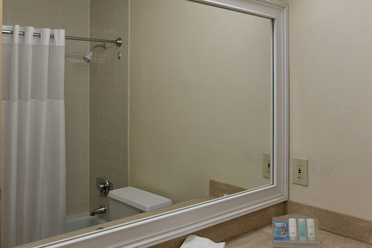 pillow-top beds, desk, laptop workspace, blackout curtains