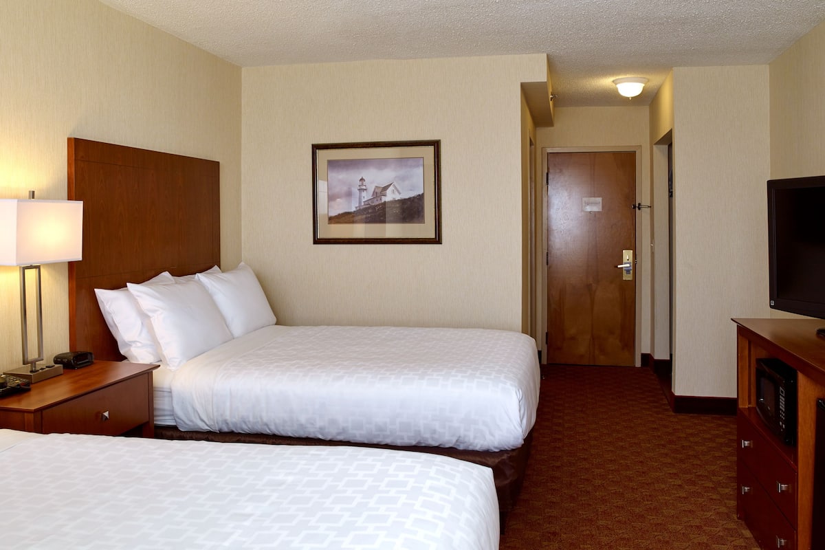 pillow-top beds, desk, laptop workspace, blackout curtains