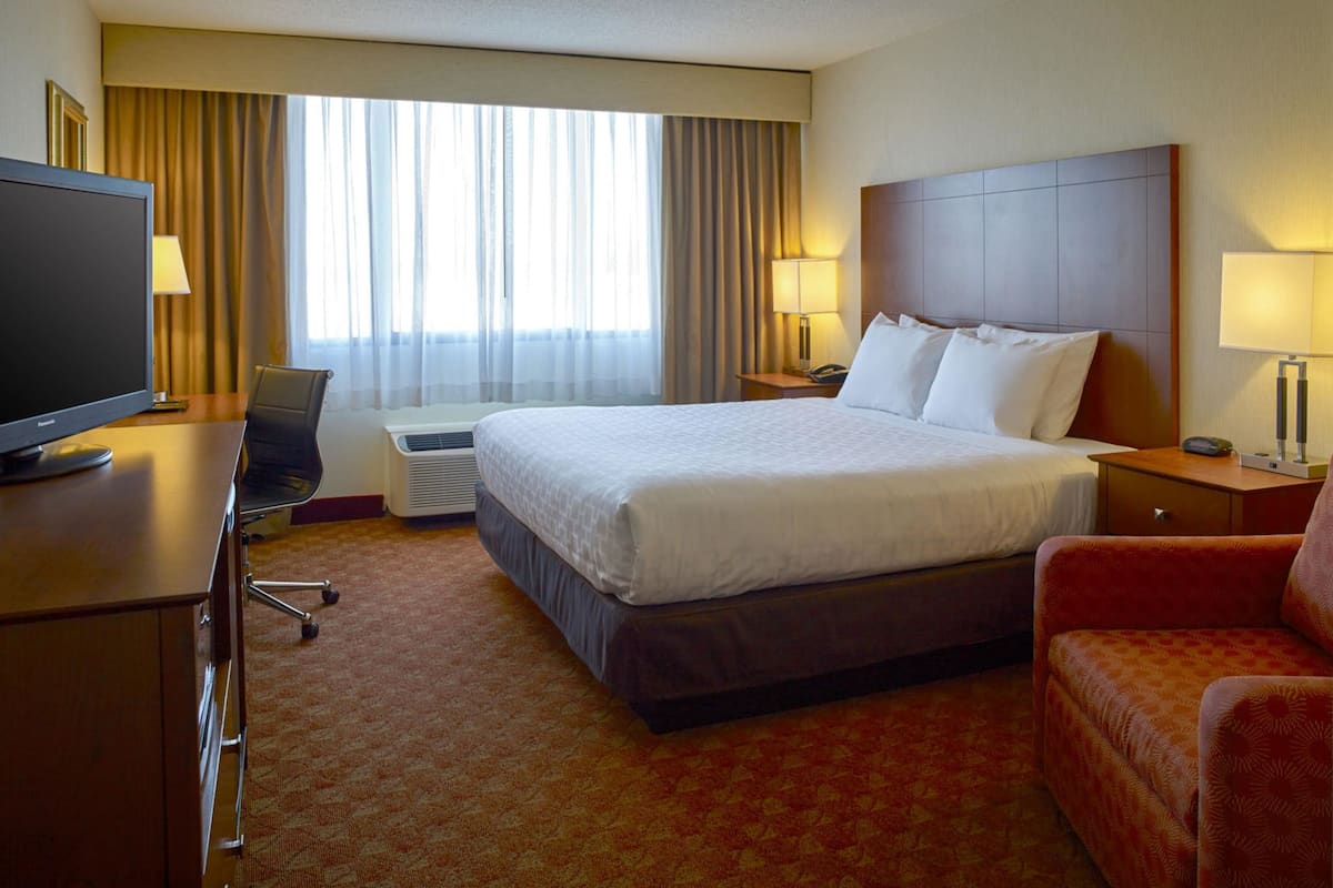 pillow-top beds, desk, laptop workspace, blackout curtains