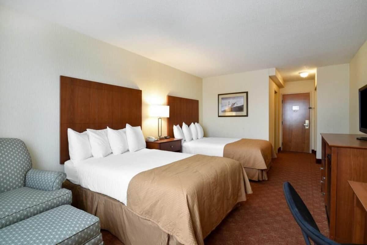 Pillowtop beds, desk, laptop workspace, blackout drapes