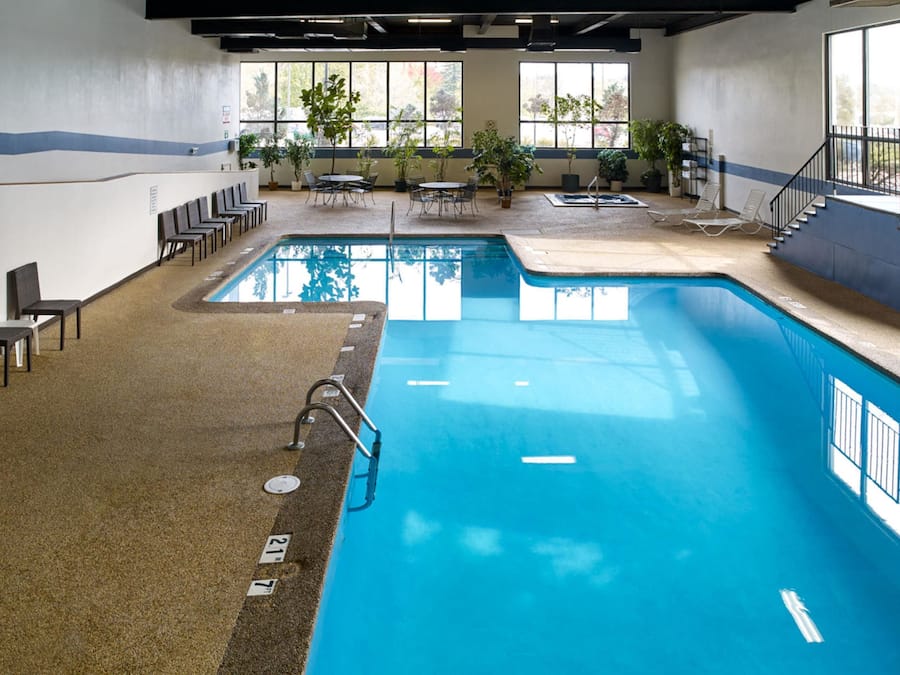 Indoor pool, open 6:00 AM to 10:00 PM, pool loungers