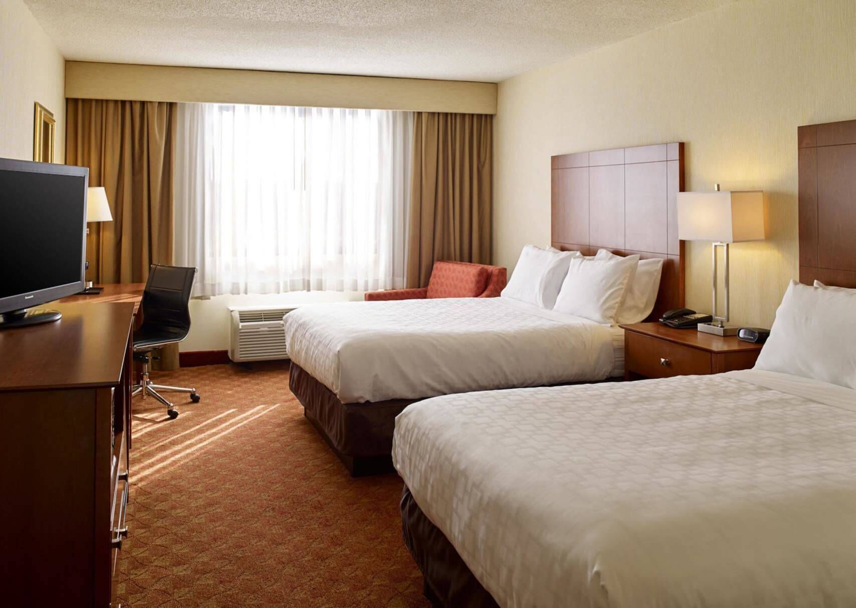 Pillowtop beds, desk, laptop workspace, blackout drapes