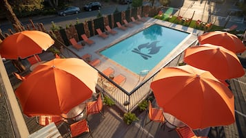 Outdoor pool, a heated pool, open 9:00 AM to 10:00 PM, pool umbrellas