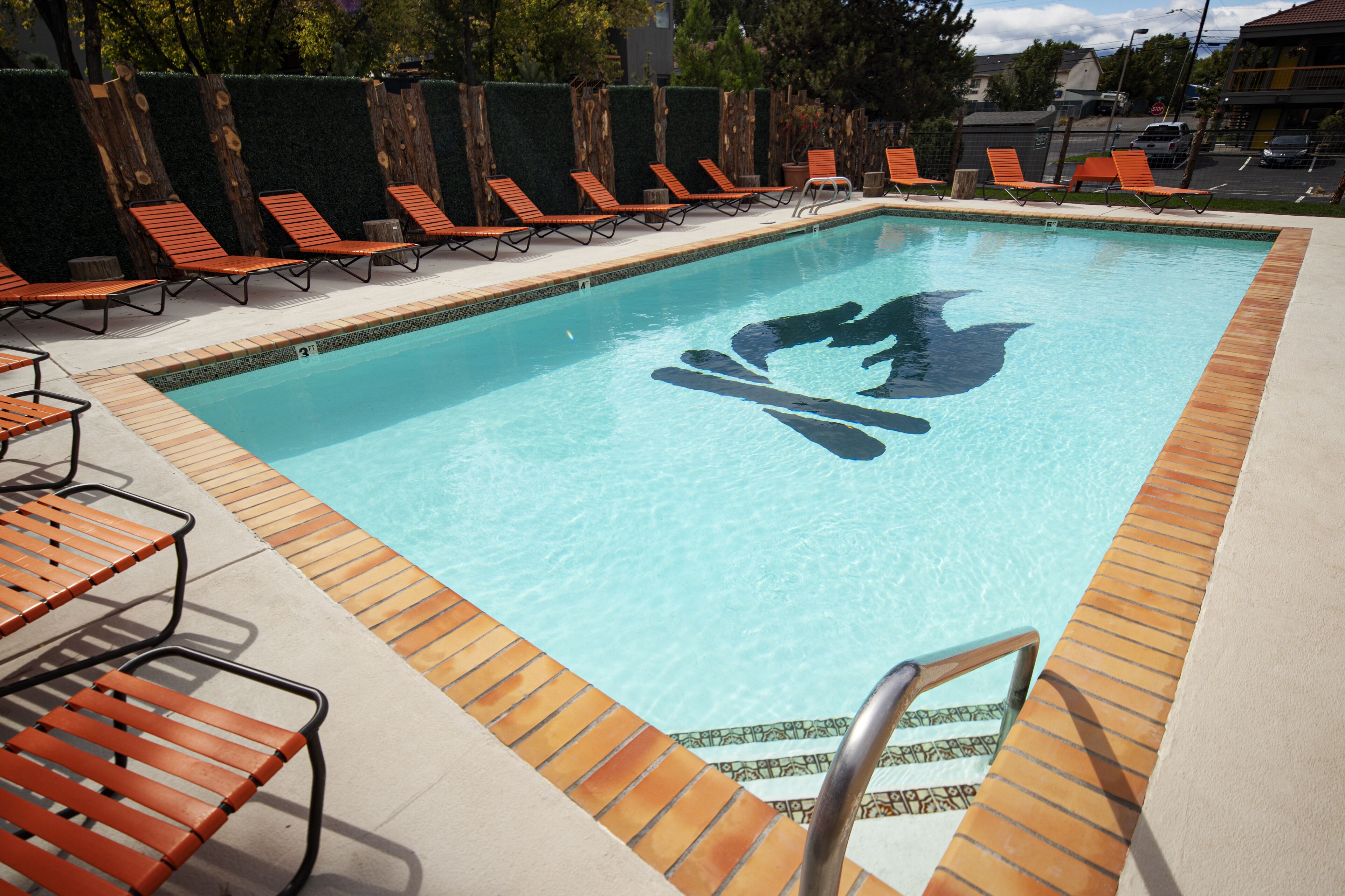 Outdoor pool, a heated pool, open 9:00 AM to 10:00 PM, free cabanas