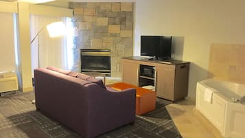 Suite, 1 King Bed, Non Smoking, Fireplace | Living area | 37-inch TV with cable channels