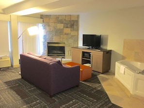 Suite, 1 King Bed, Non Smoking, Fireplace | Living area | 37-inch TV with cable channels