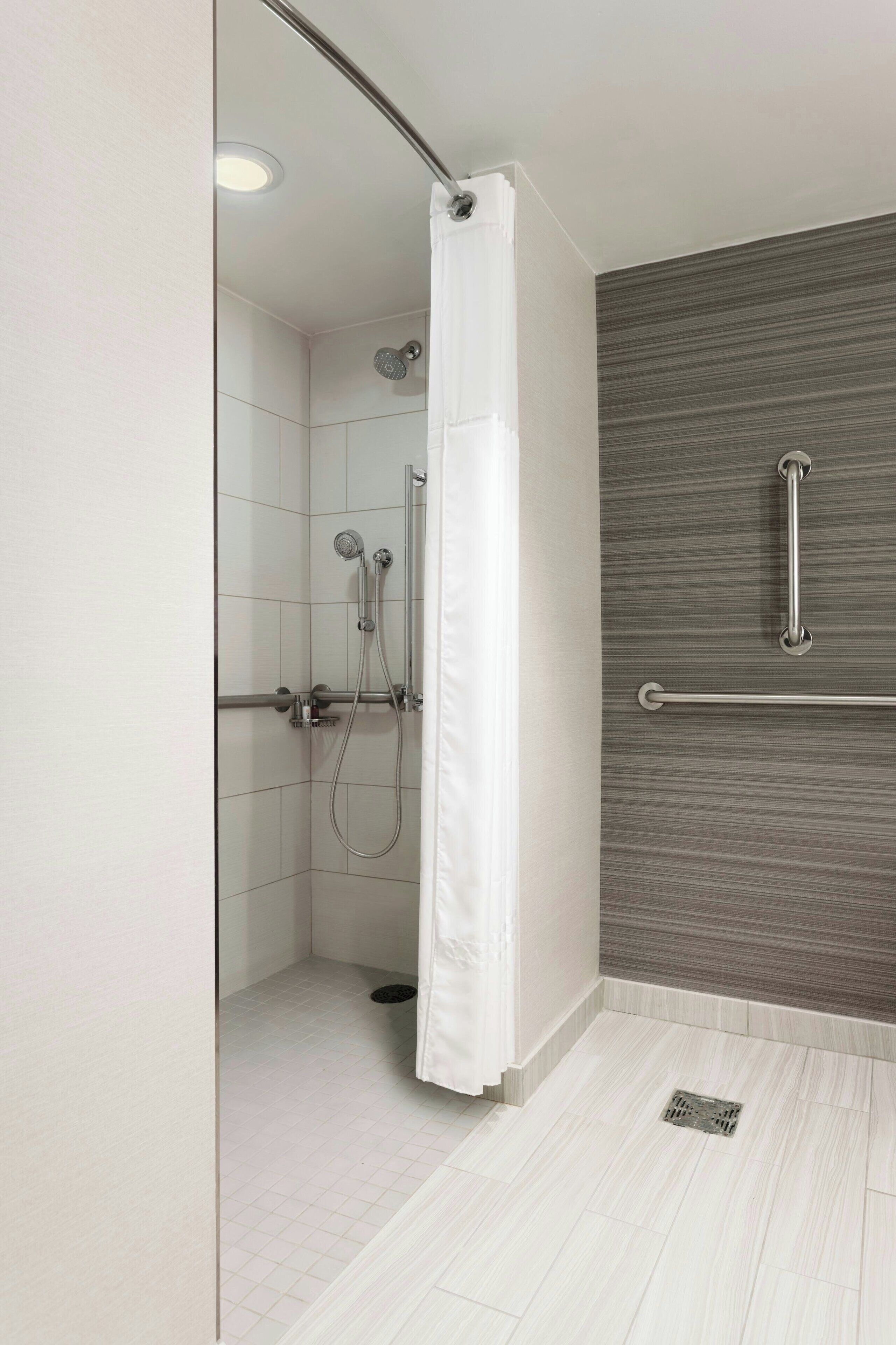 combined shower/bathtub, deep-soaking bathtub, designer toiletries