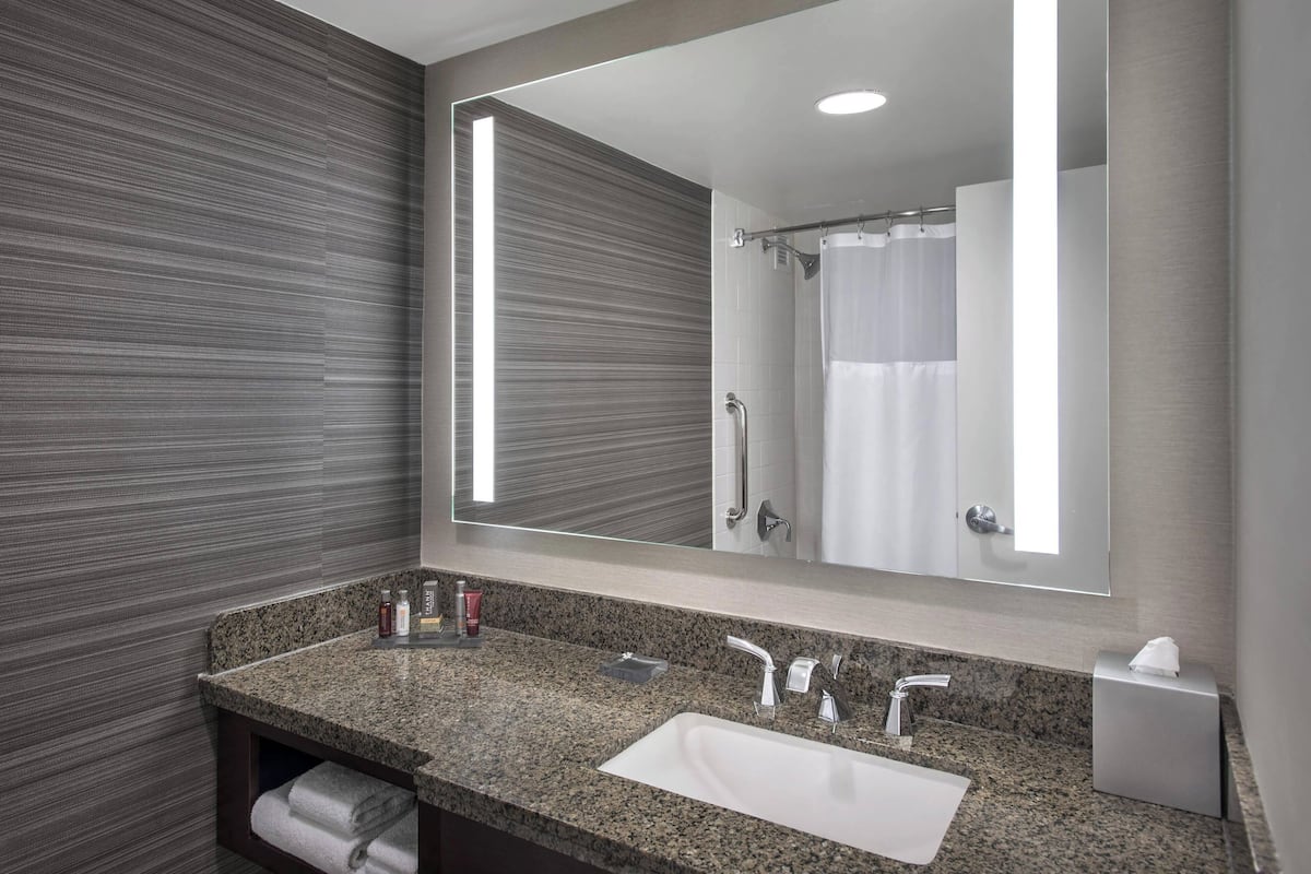 combined shower/bathtub, deep-soaking bathtub, designer toiletries