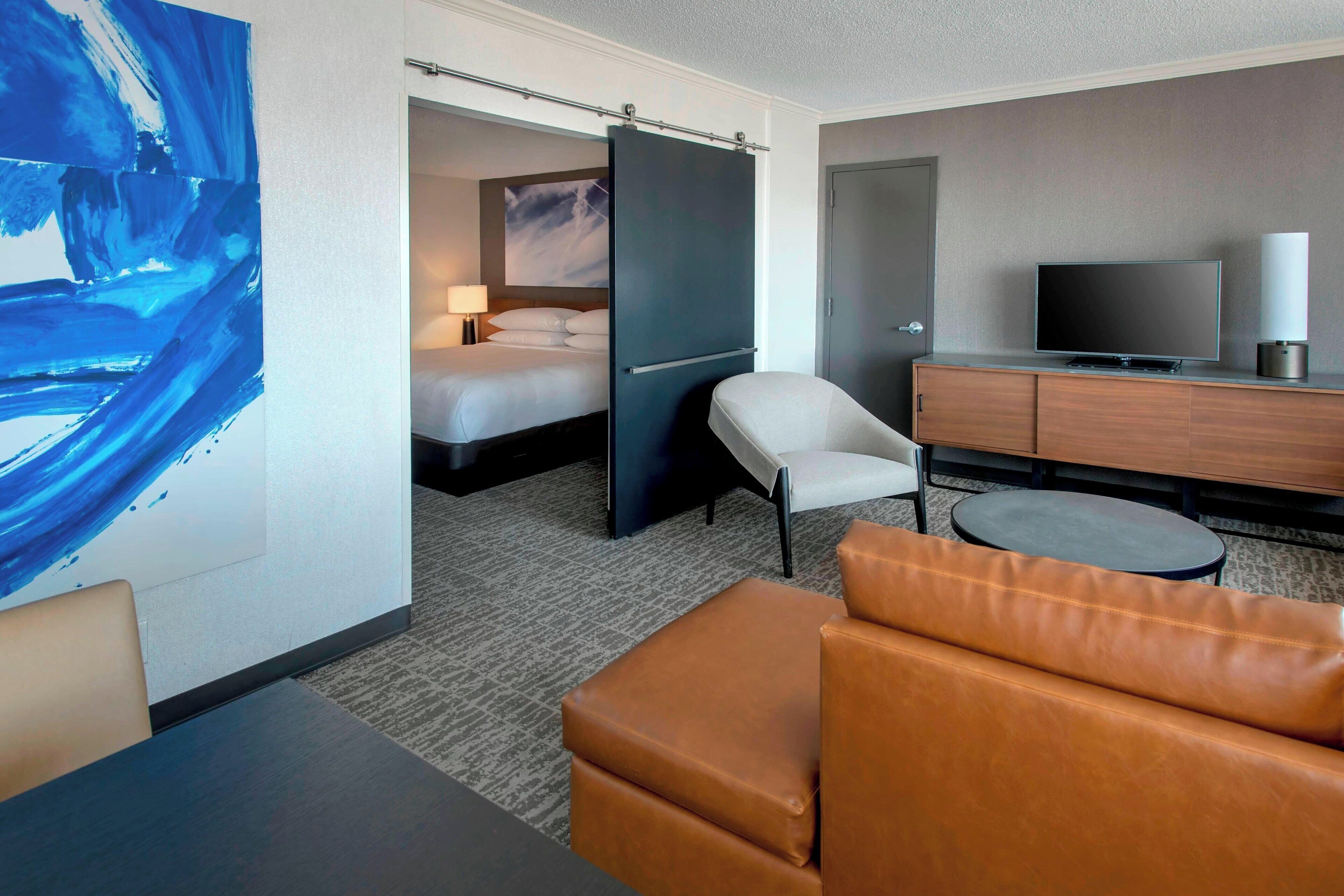 suite, 1 king bed, non smoking | living area | 37-inch flat-screen tv with cable channels, tv, ipod dock