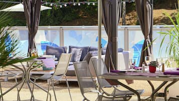 Breakfast, lunch, dinner served; local cuisine, pool views