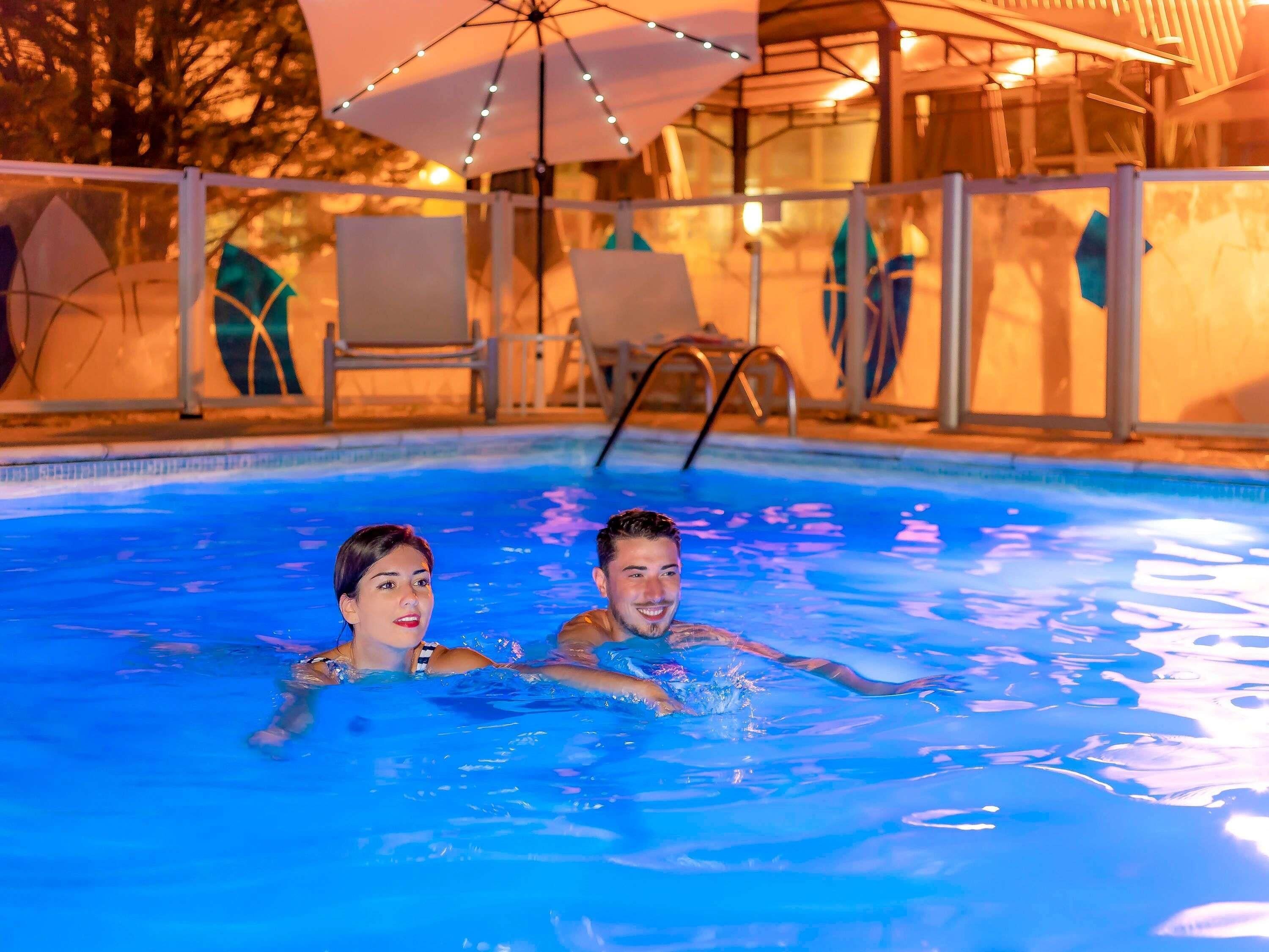 Seasonal outdoor pool, open 10:00 AM to 8:00 PM, pool umbrellas