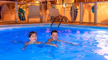 Seasonal outdoor pool, open 10:00 AM to 8:00 PM, pool umbrellas