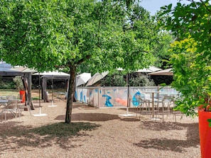 Seasonal outdoor pool, open 10:00 AM to 8:00 PM, pool umbrellas