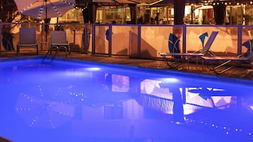 Seasonal outdoor pool, open 10:00 AM to 8:00 PM, pool umbrellas