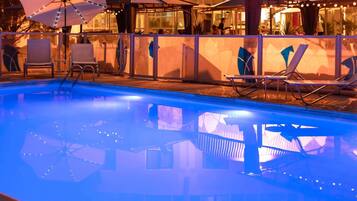 Seasonal outdoor pool, open 10:00 AM to 8:00 PM, pool umbrellas