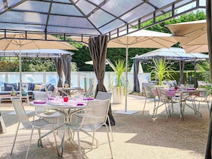Breakfast, lunch, dinner served; local cuisine, pool views