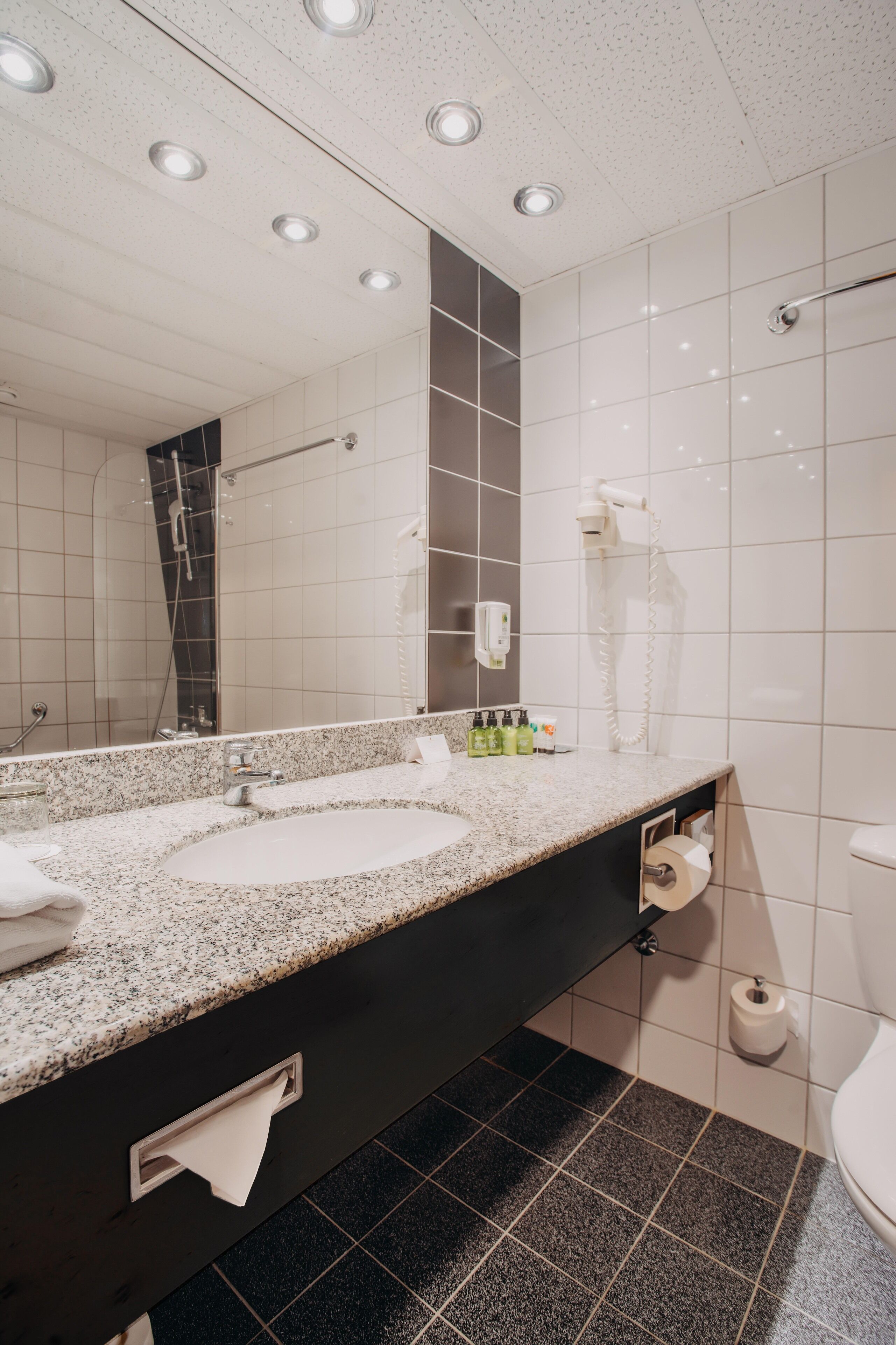 eco-friendly toiletries, slippers, towels