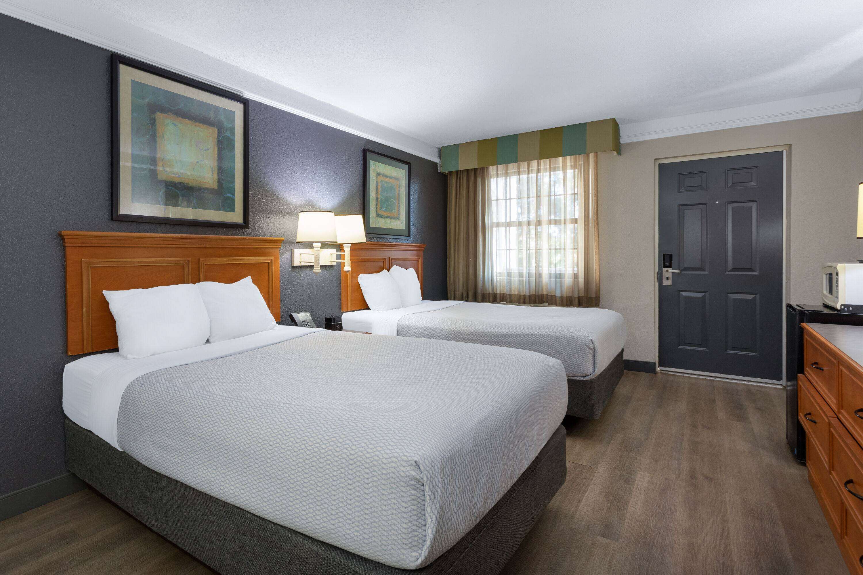 premium bedding, desk, laptop workspace, iron/ironing board