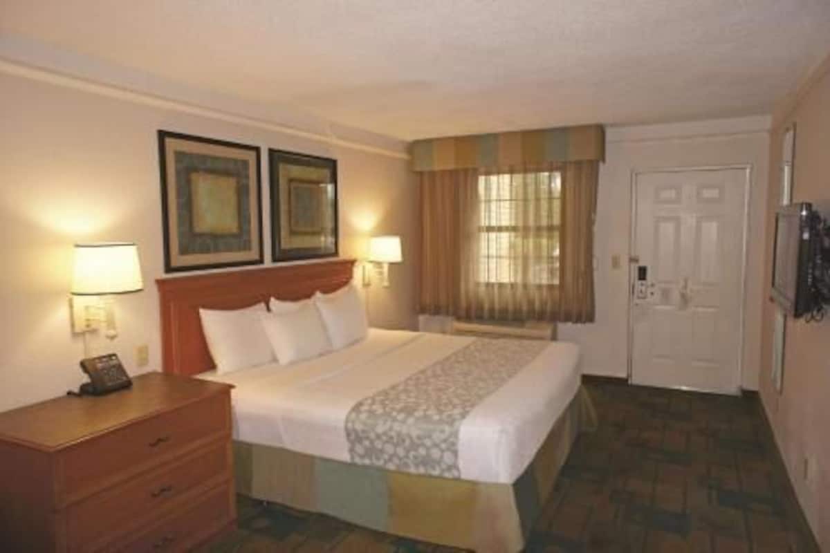 Premium bedding, desk, laptop workspace, iron/ironing board