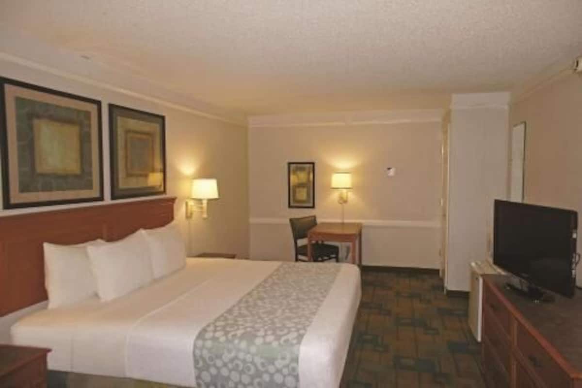 Premium bedding, desk, laptop workspace, iron/ironing board