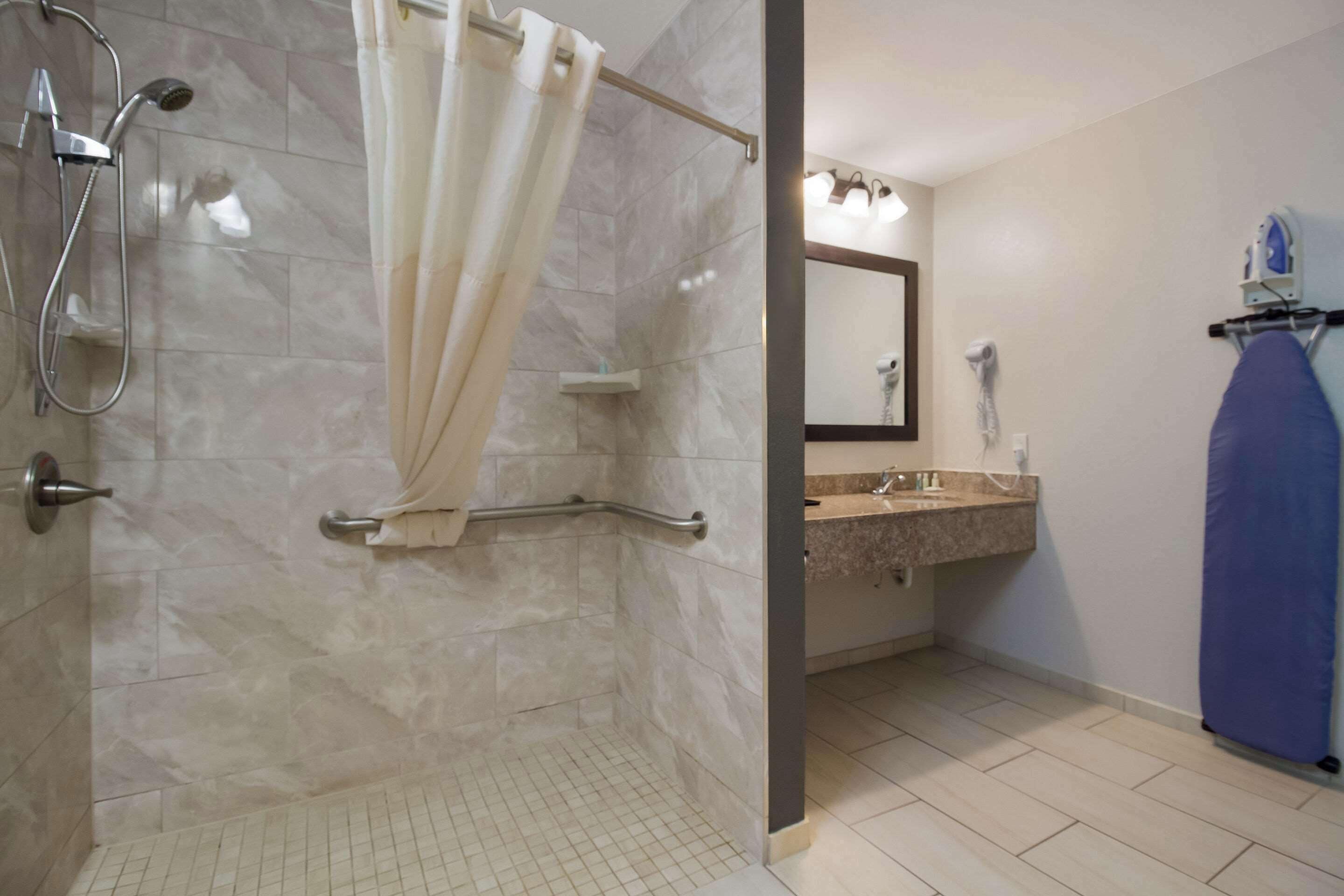 room, 1 king bed, accessible, non smoking | in-room safe, desk, laptop workspace, iron/ironing board