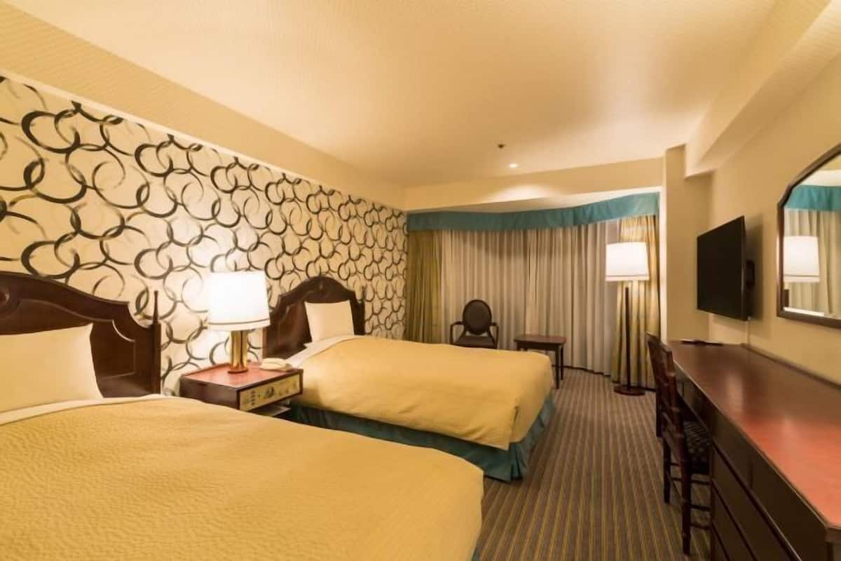 Premium bedding, down duvets, in-room safe, desk