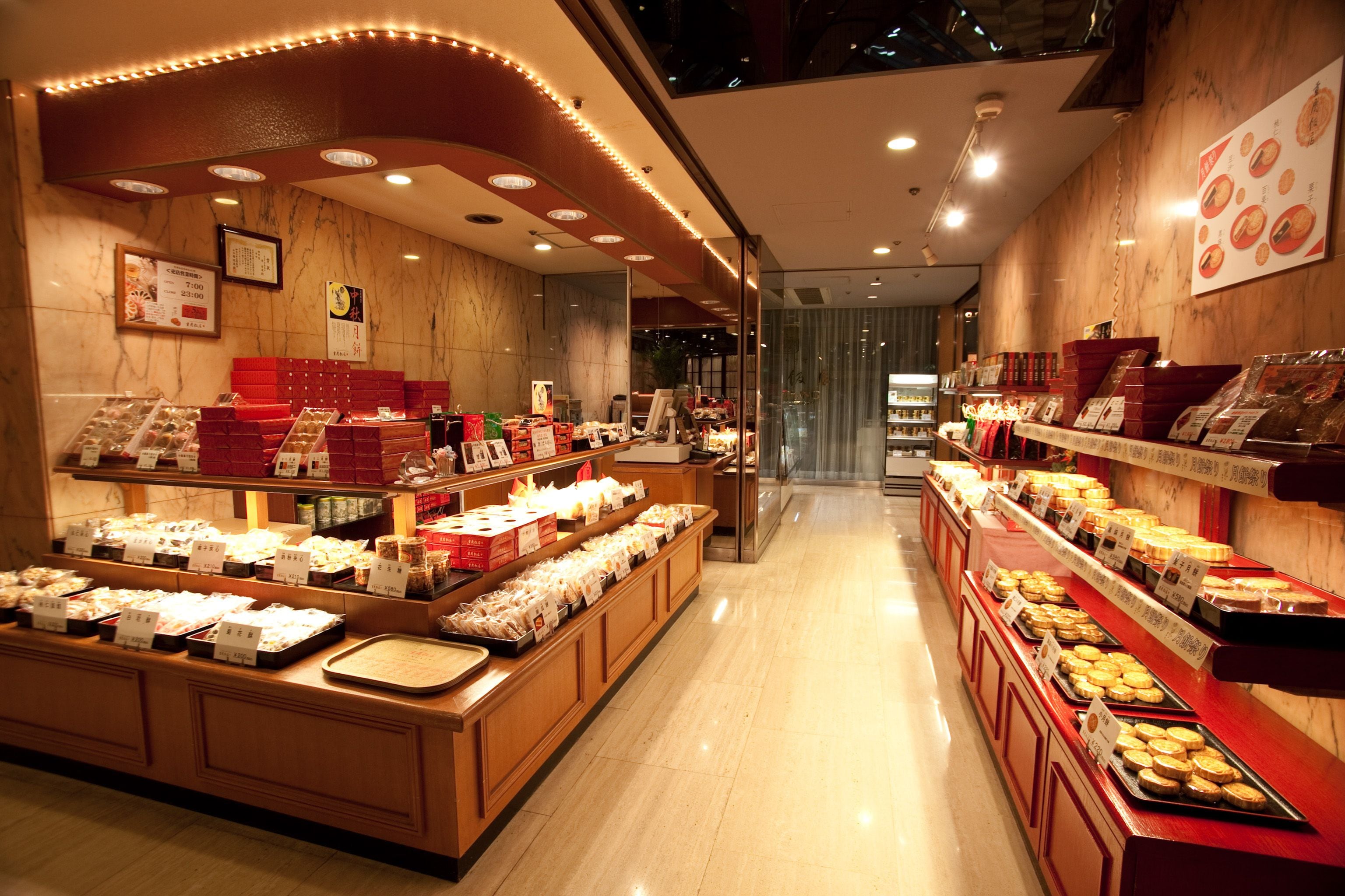 A bakery display with various baked goods and pastries.