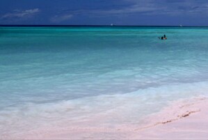 Beach nearby, white sand, beach towels