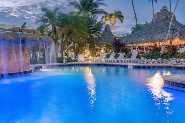 Outdoor pool, open 7:00 AM to 11:00 PM, pool umbrellas, sun loungers