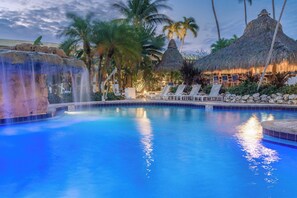 A swimming pool with lounge chairs and a waterfall feature. - Holiday Inn Key Largo by IHG (Key Largo)