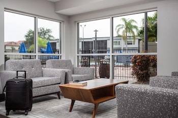 Sitting area in hotel lobby at Orbit One Vacation Villas