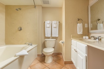 Combined shower/tub, deep soaking tub, eco-friendly toiletries at Orbit One Vacation Villas