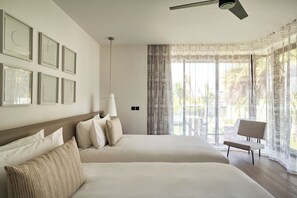 Chambre, plusieurs lits (LUX* Pool Villa) | Draps en coton égyptien, literie de qualité supérieure