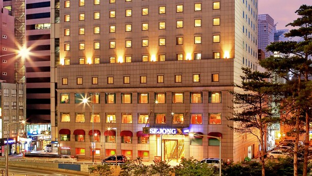 A multi-story hotel with a prominent 'SEJONG' sign on the top. - Sejong Hotel (Seoul)