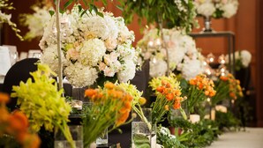 A long table with floral centerpieces and candles, suggesting a formal event setting. - Sejong Hotel (Seoul)