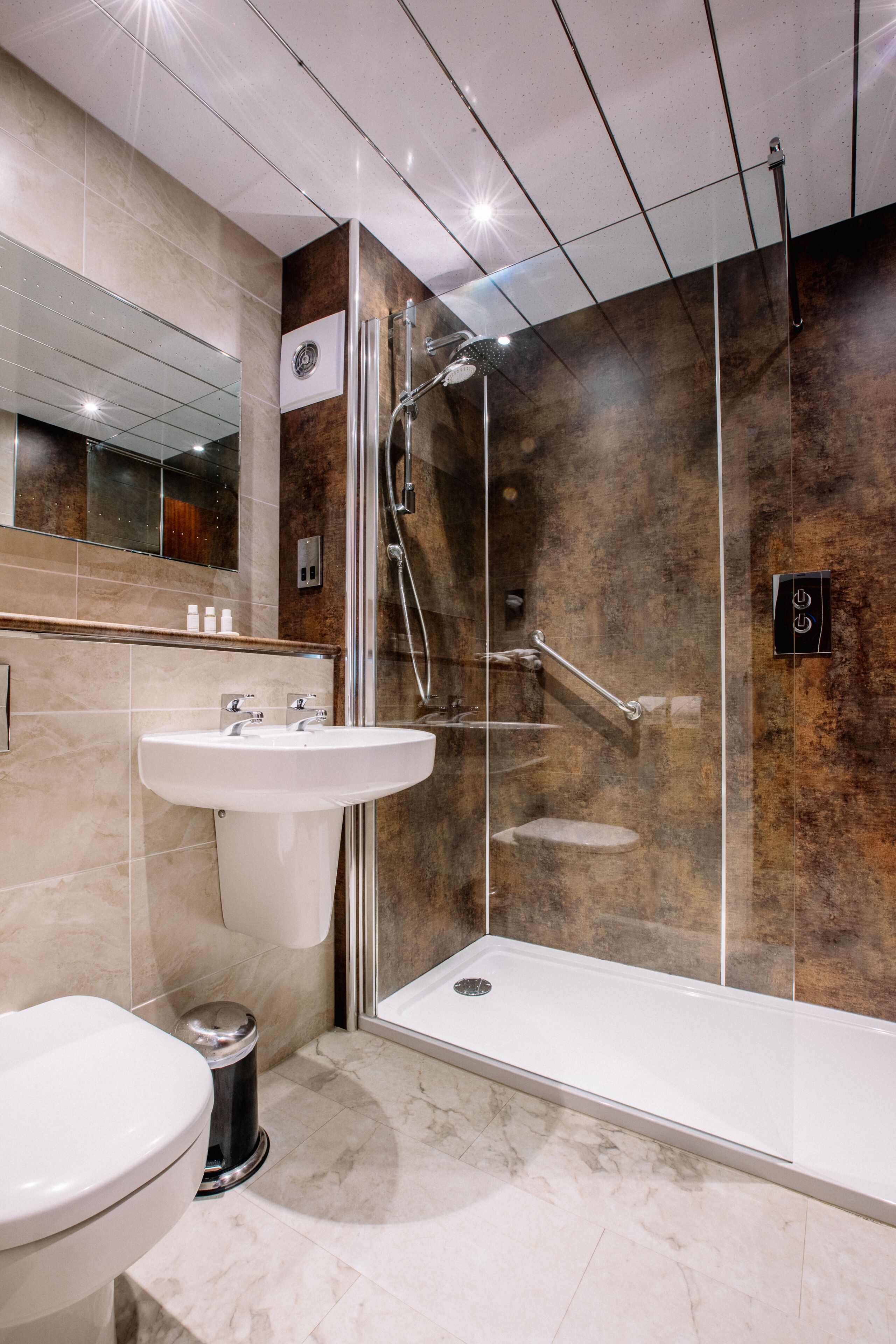 designer toiletries, hair dryer, towels, soap