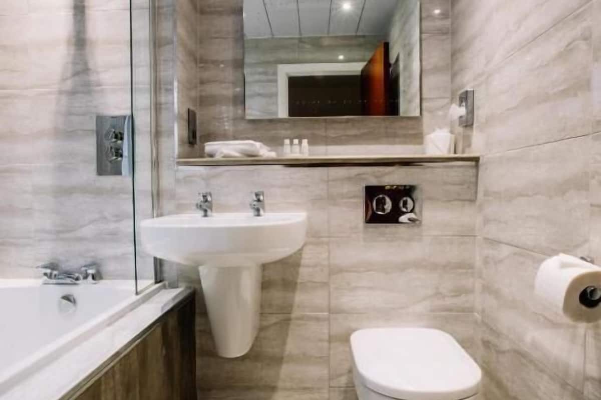 designer toiletries, hair dryer, towels, soap