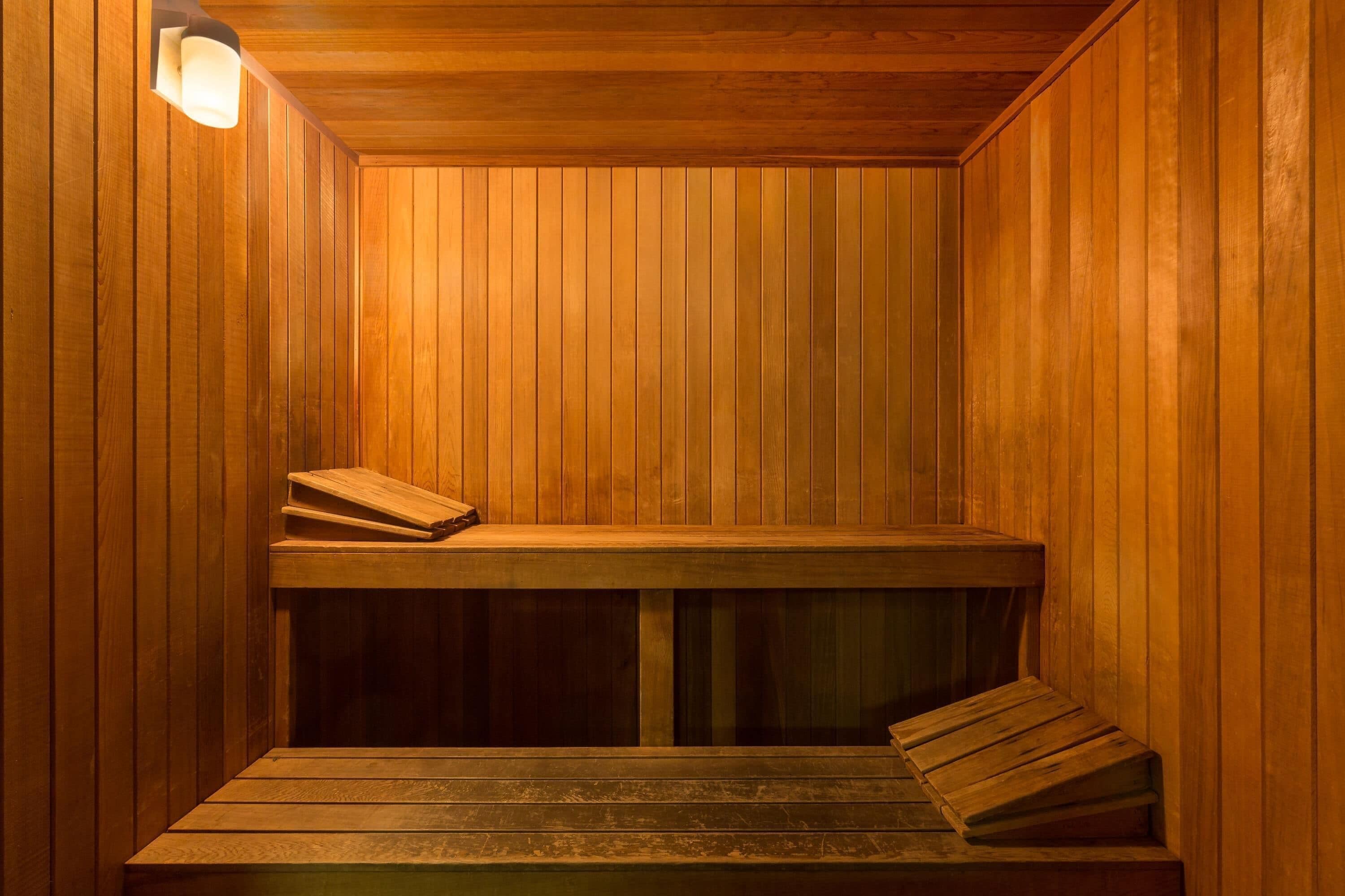 A sauna with wooden walls and benches.
