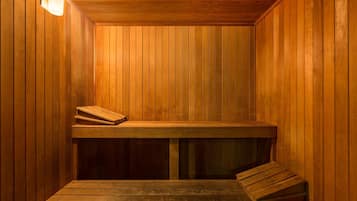 A sauna with wooden walls and benches.