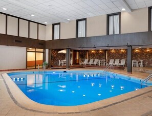 Indoor pool, a heated pool, open 6:00 AM to 10:00 PM, sun loungers