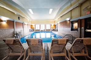 Indoor pool, open 7 AM to 11:00 PM, pool loungers