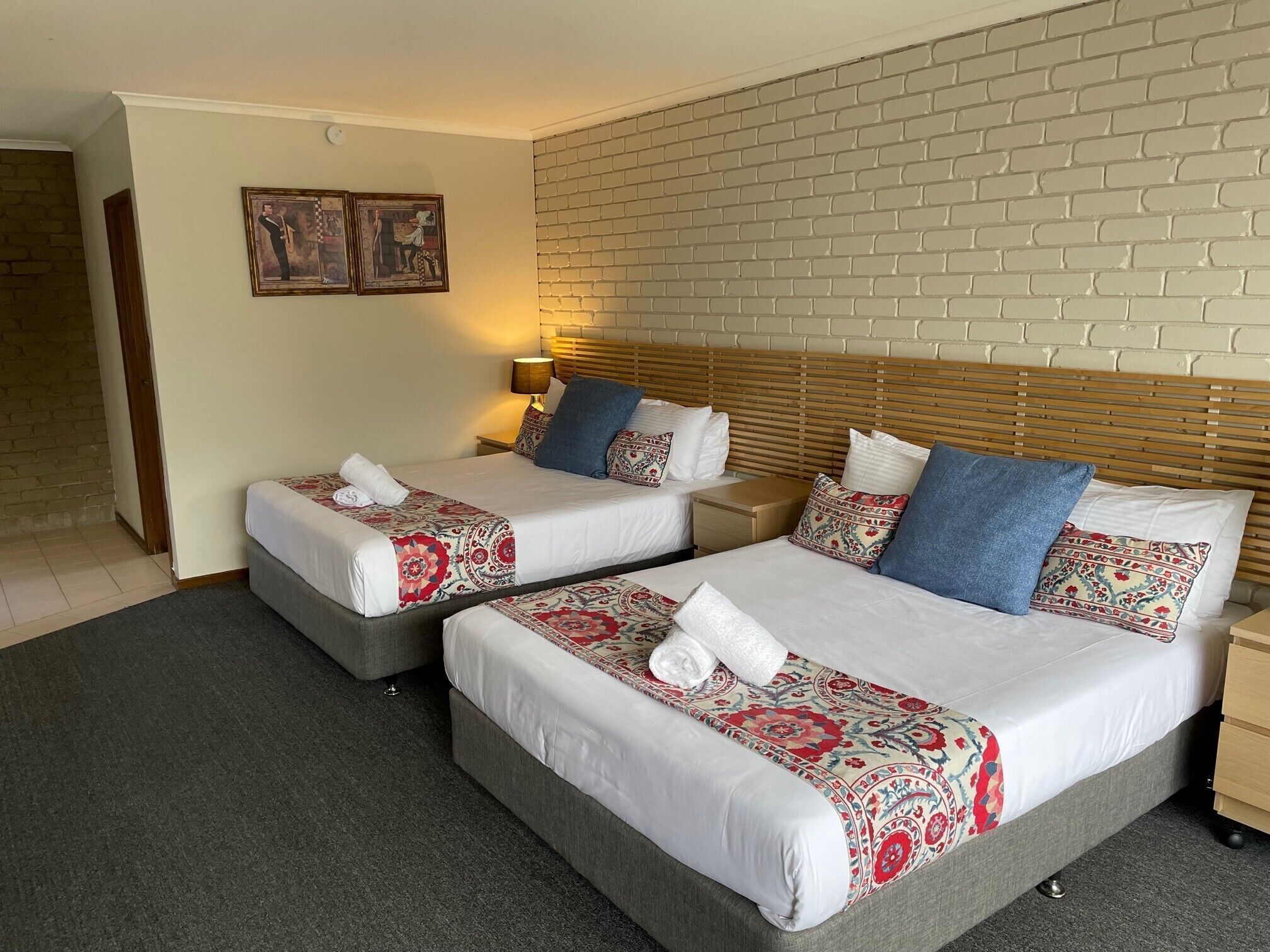 Pillowtop beds, desk, laptop workspace, blackout drapes