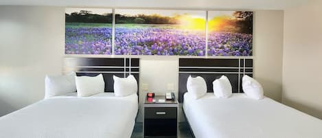 Pillowtop beds, desk, blackout drapes, iron/ironing board